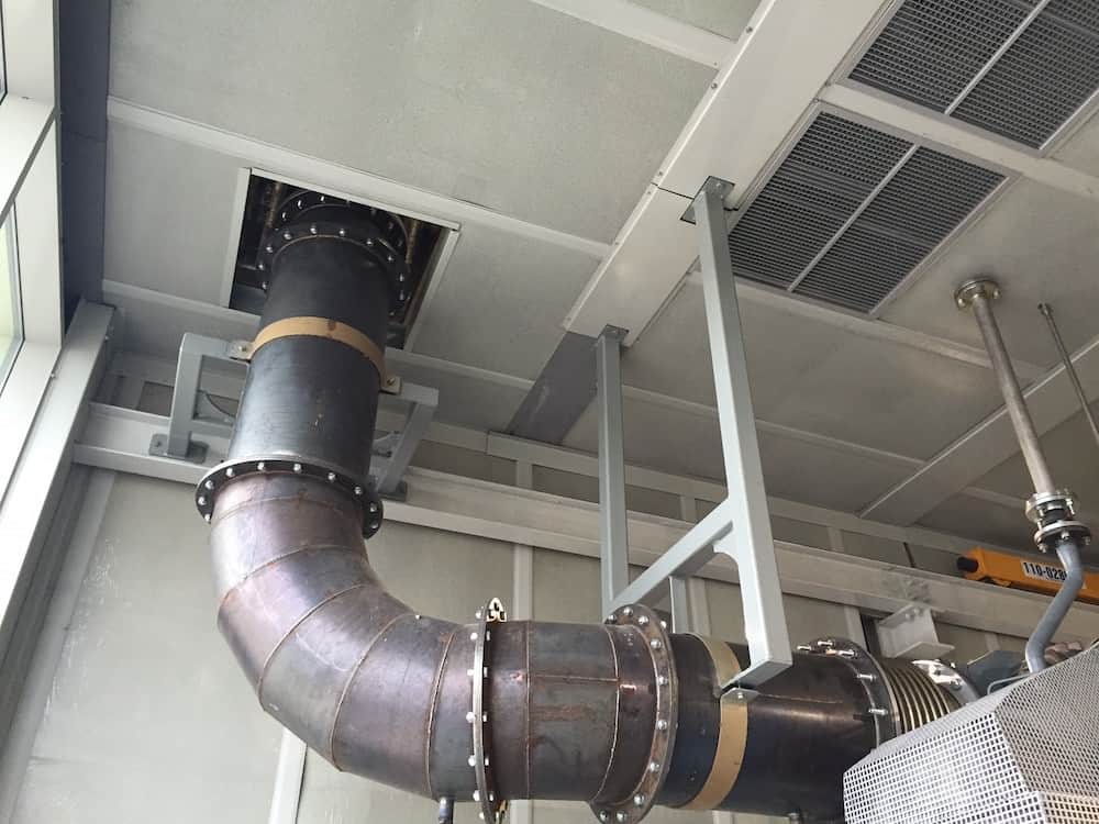 Huge pipe flows up through the ceiling