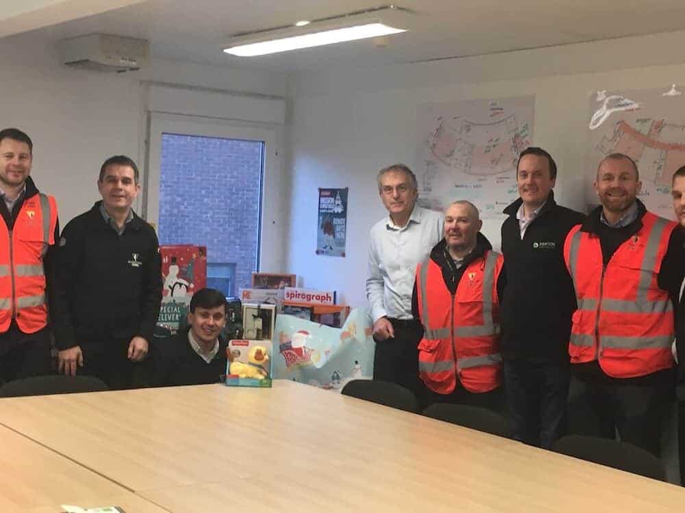 Kimpton with Wilmott Dixon donating to Mission Christmas