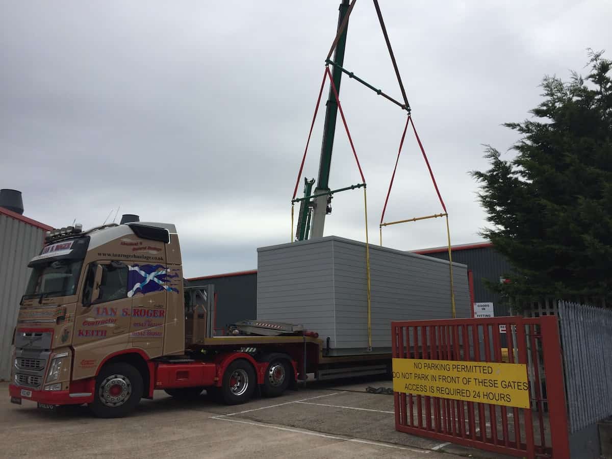 Lifting the completed unit onto the back of the lorry for delivery