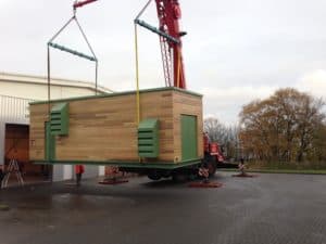 Packaged Plant Being craned into site for Combined Heat and Power Acoustic Enclosure