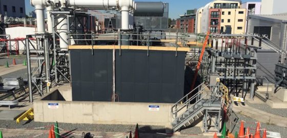 The view across the site showing the new enclosure and the GIS transformers in place